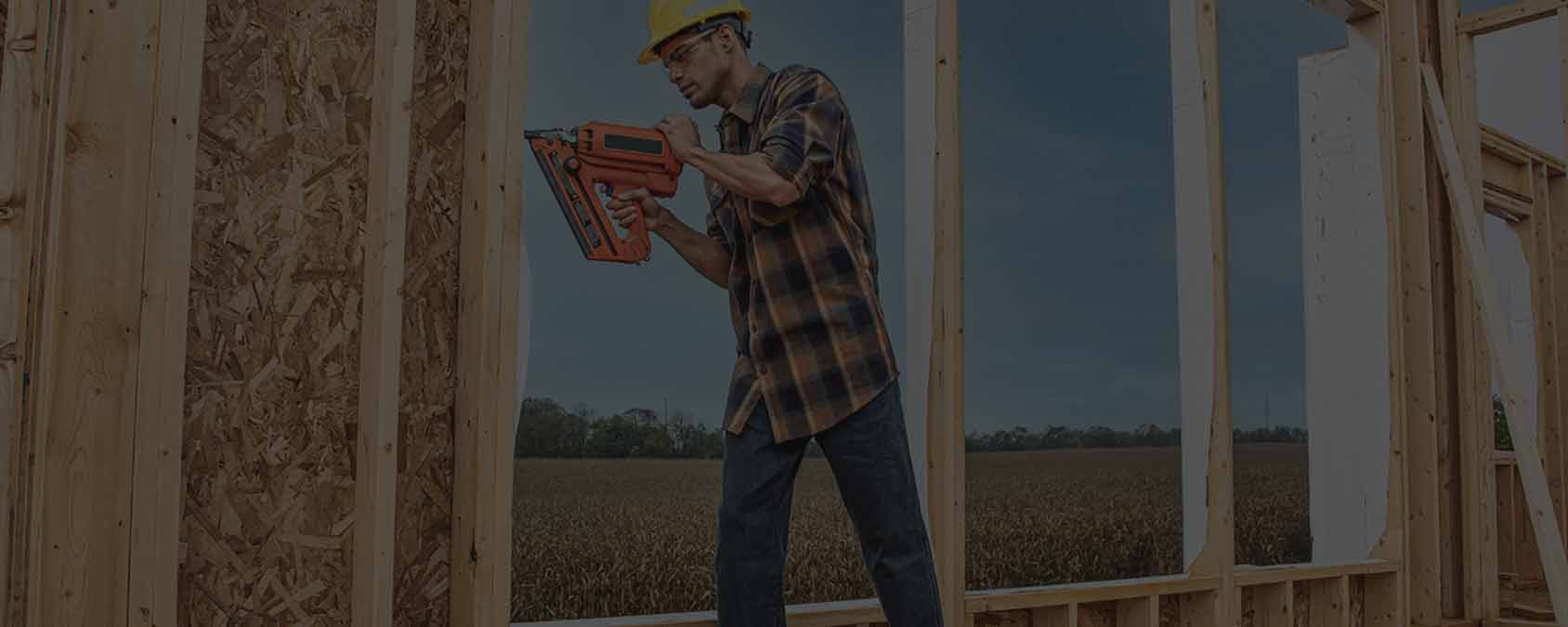 a construction worker wearing a Work n’ Sport Men’s Long Sleeve Super Brawny Flannel. 